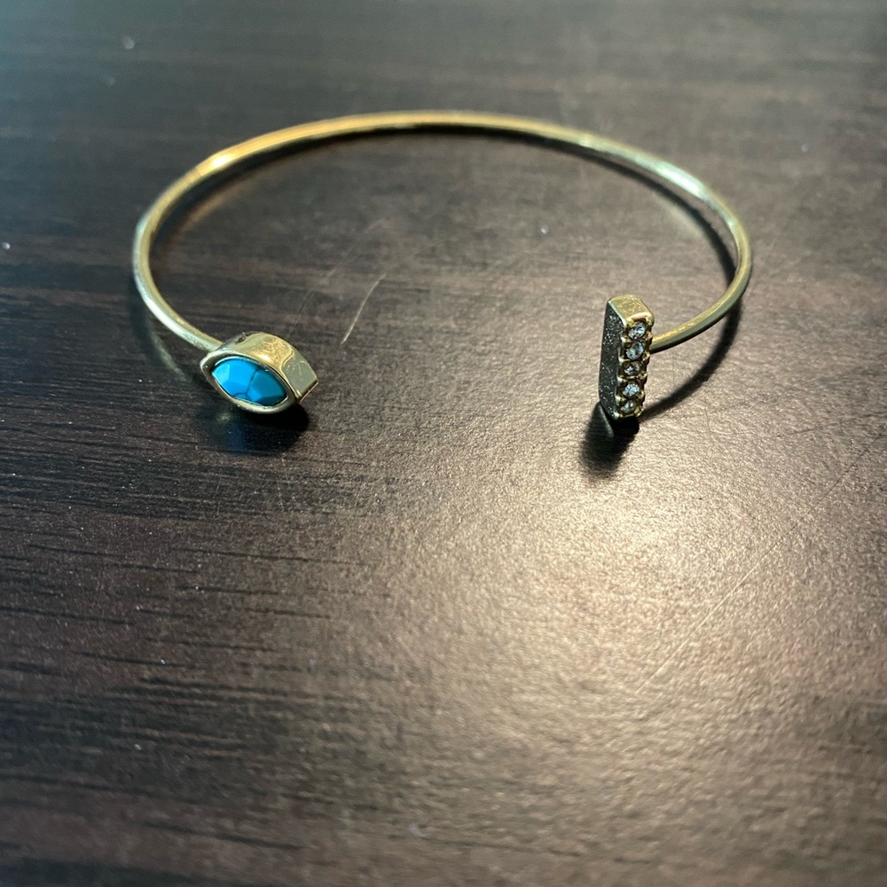 Gold tone bangle
